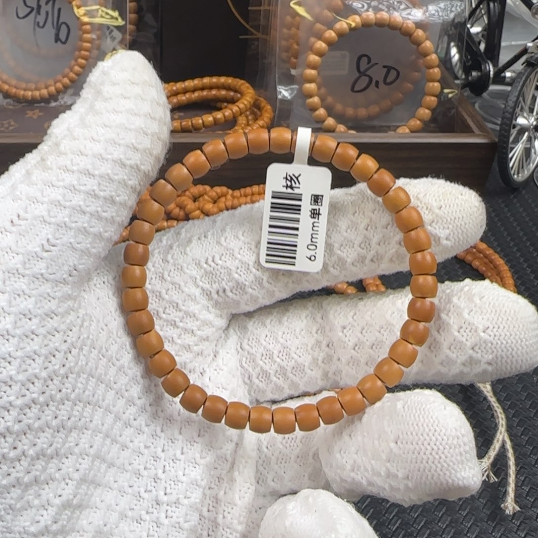 橄榄核吊坠6.0mm老挝核尖微露白直切单圈（福利款）