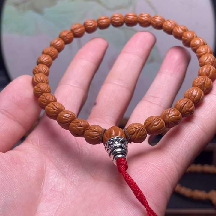 羽***霏桃核手串9玉龙脊手持