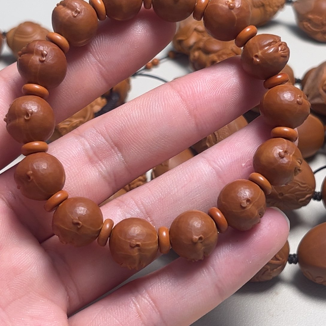 橄榄核吊坠艾***斯人生百态