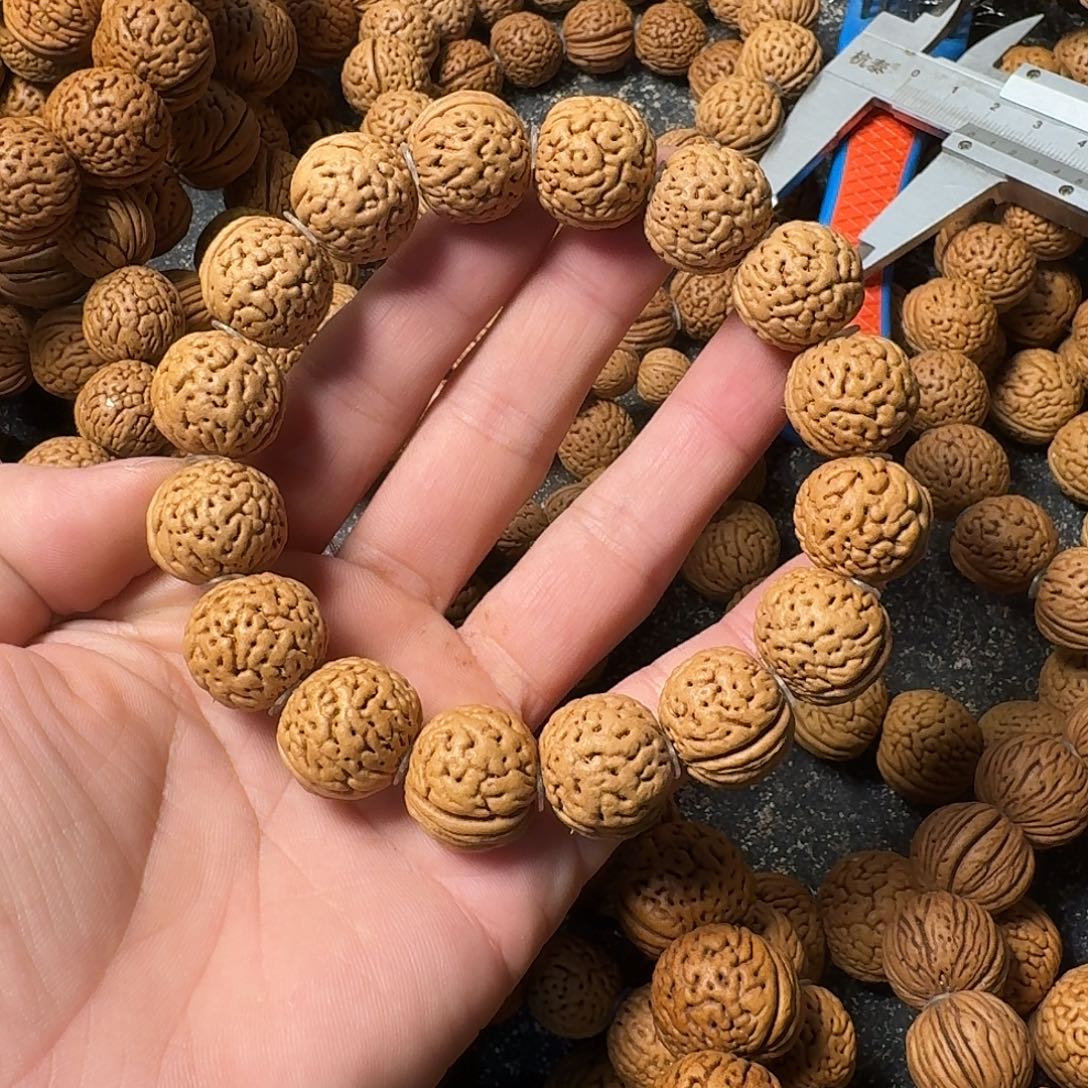 1***.桃核吊坠野生手串