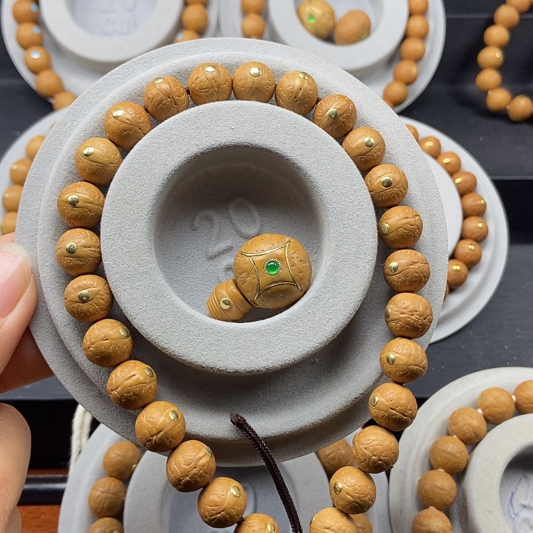 靖***哥手串凤眼菩提11➕铜手持麒麟