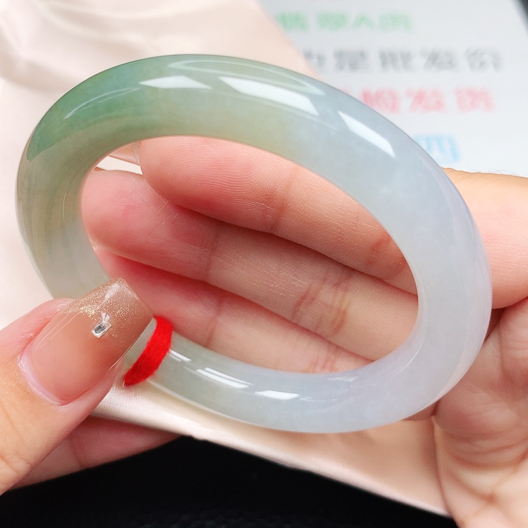 未镶嵌手镯翡翠53圆条 特色冰胶黄加绿半山水