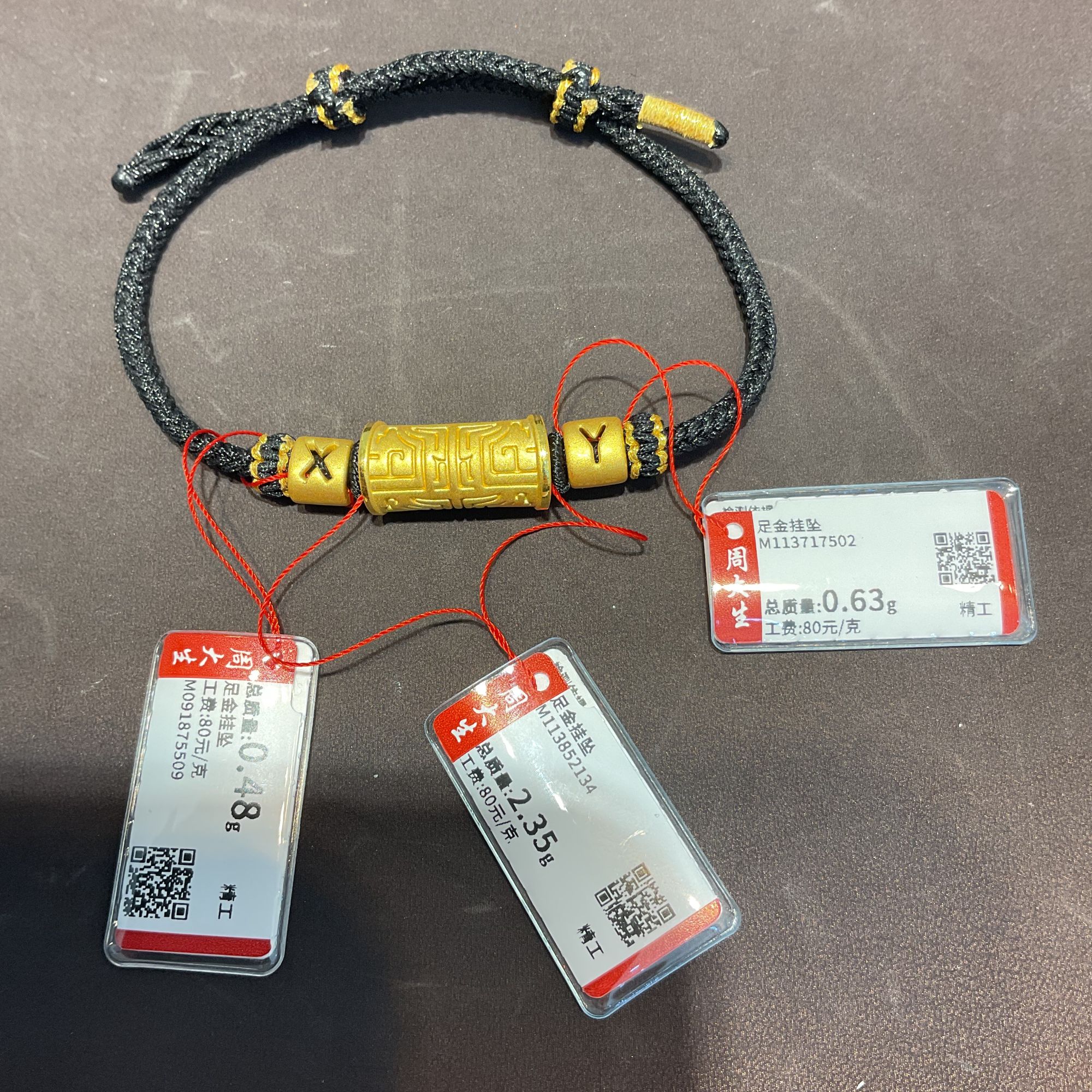 Chow Tai Seng/周大生足金饕餮字母手编