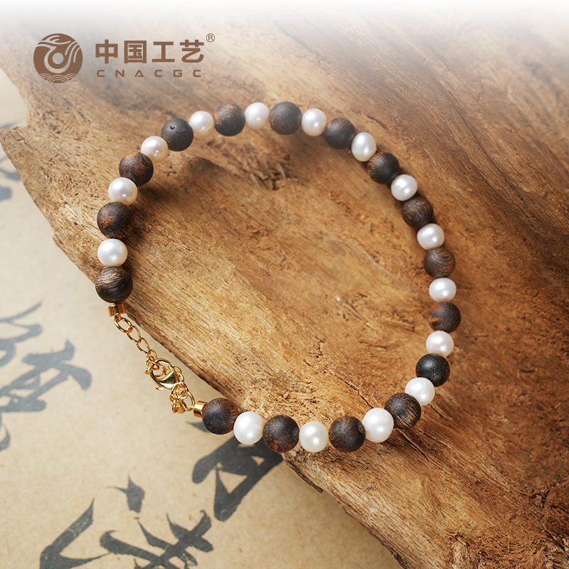 沉香【中国工艺】6mm圆珠隔珍珠设计款沉香99沉手串多样性发其一