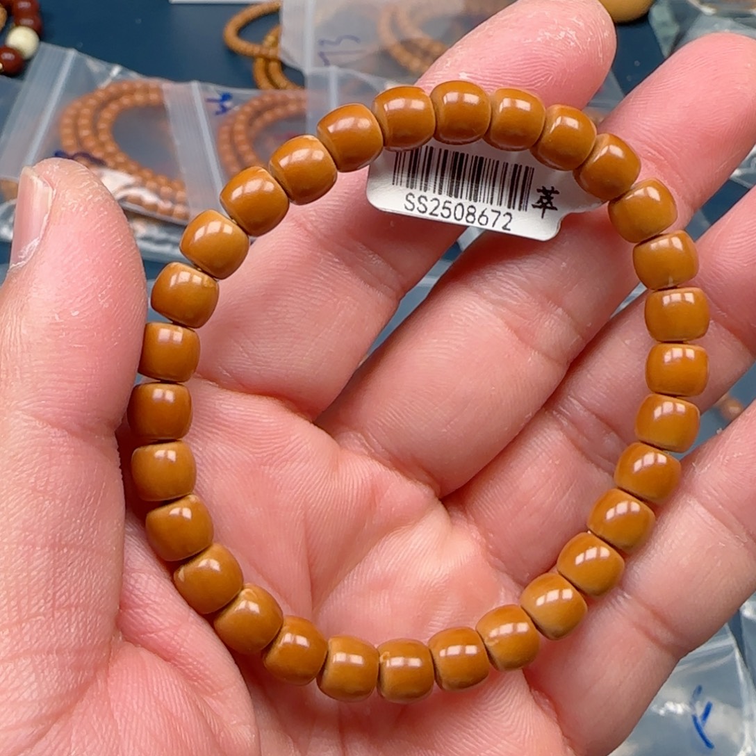 哈***夫手串橄榄核老挝SSS级核尖极限弧尺寸7.5微白