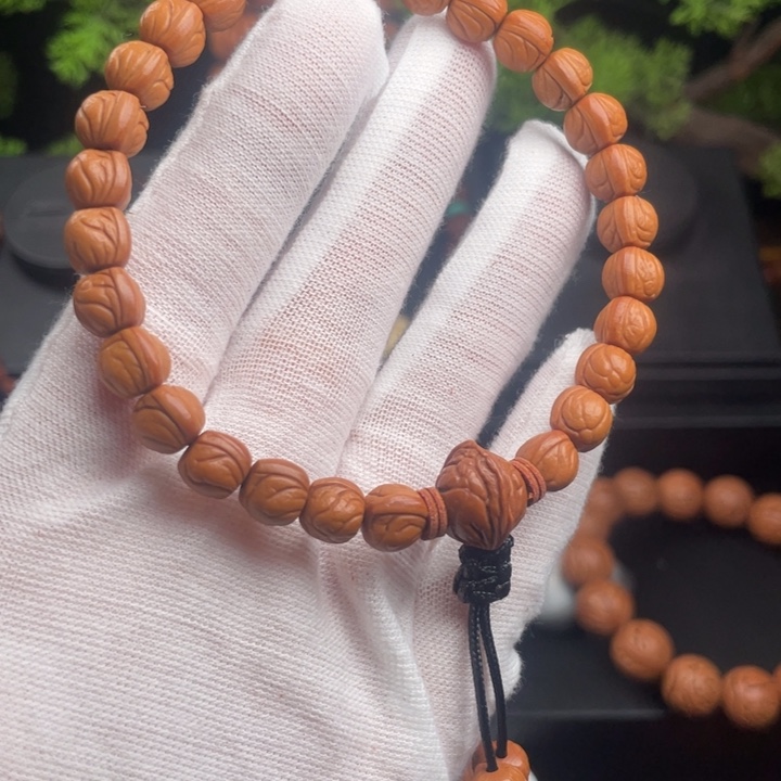 廉***韵桃核吊坠精品手持