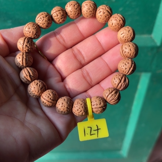 精***闹木质野生桃核手串