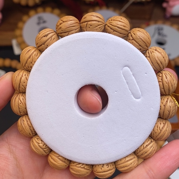 桃核手串凤羽12齐窄桩高