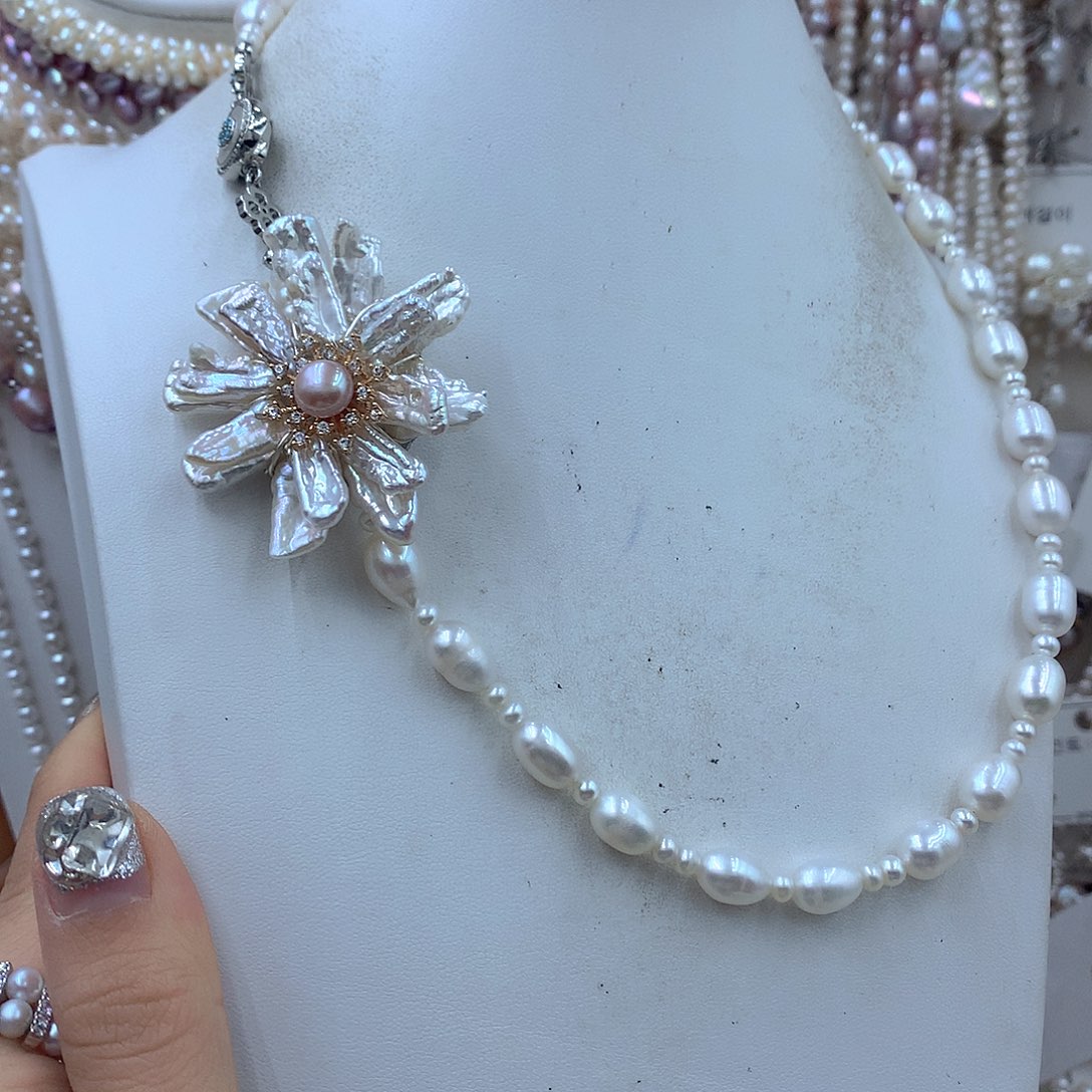 须***浅淡水珍珠银S925镶嵌耳饰