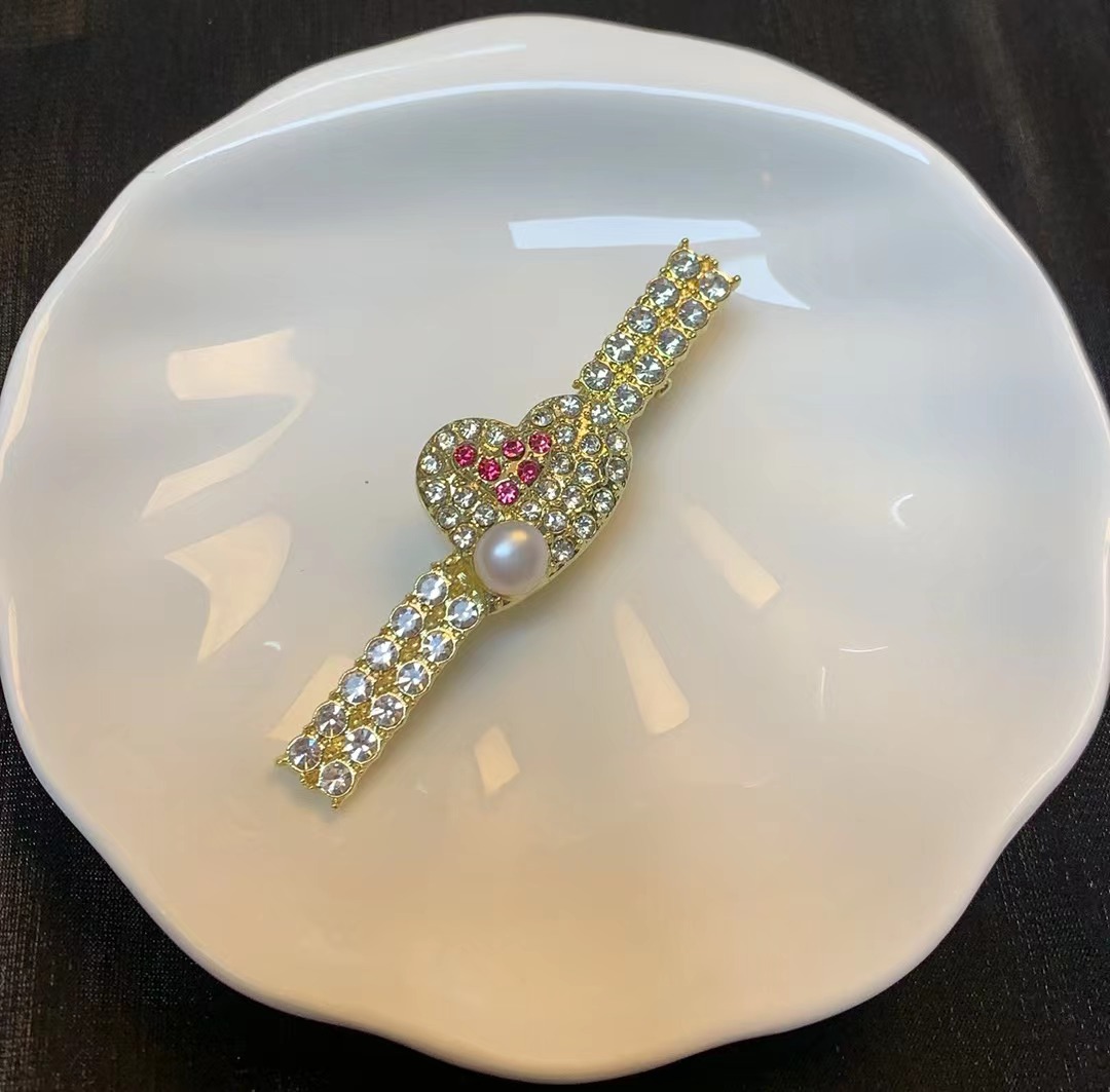 770 粉色爱心结珍珠发夹