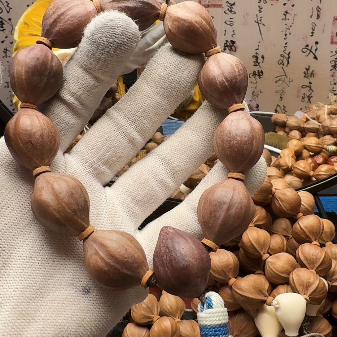 边***拉橄榄核手串紫皮核