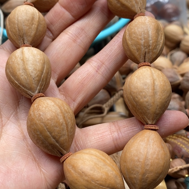 吊坠橄榄核笨***?