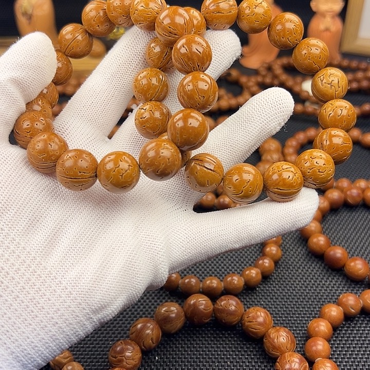 但***程野生东北桃核光珠