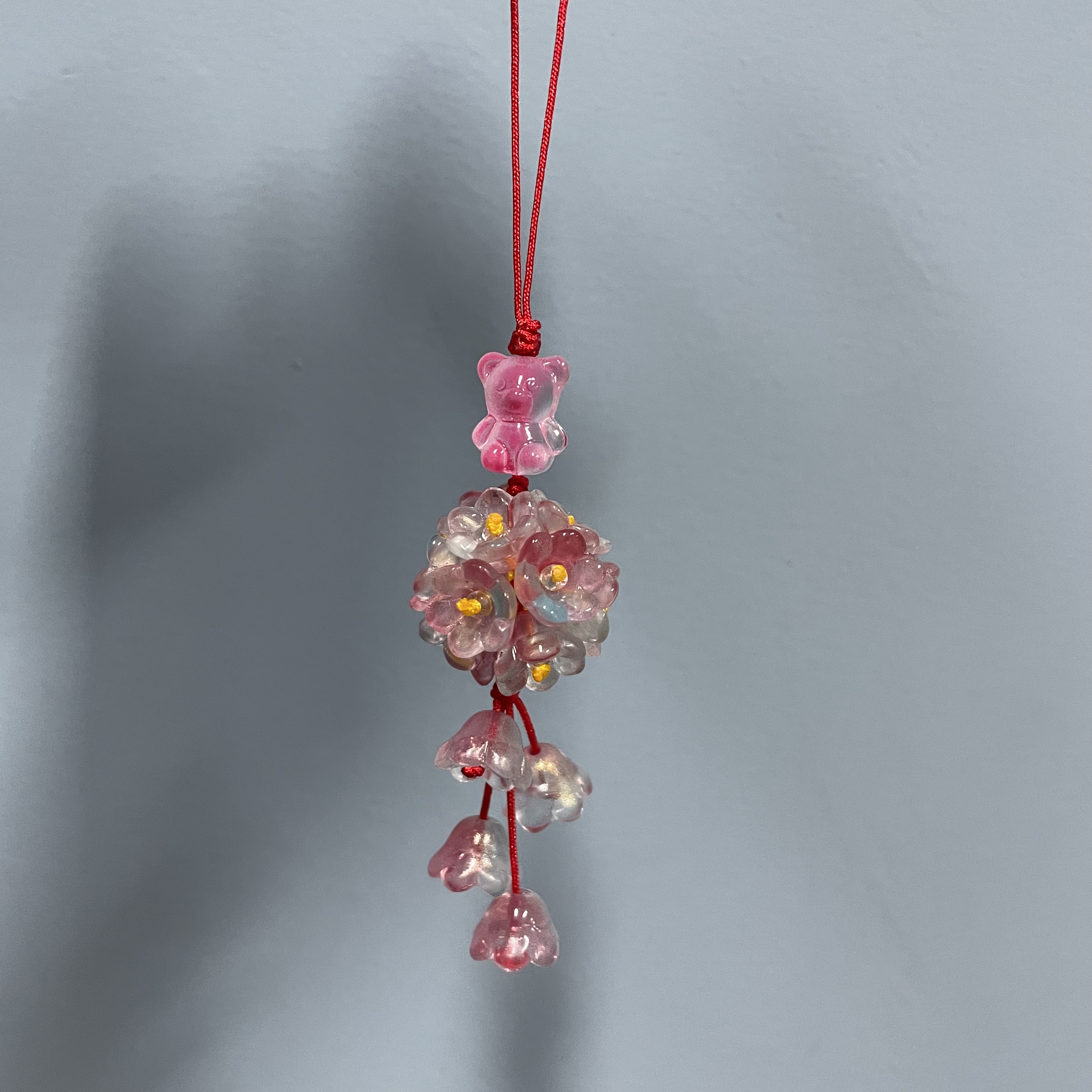 绳款粉蓝花团手机坠E714