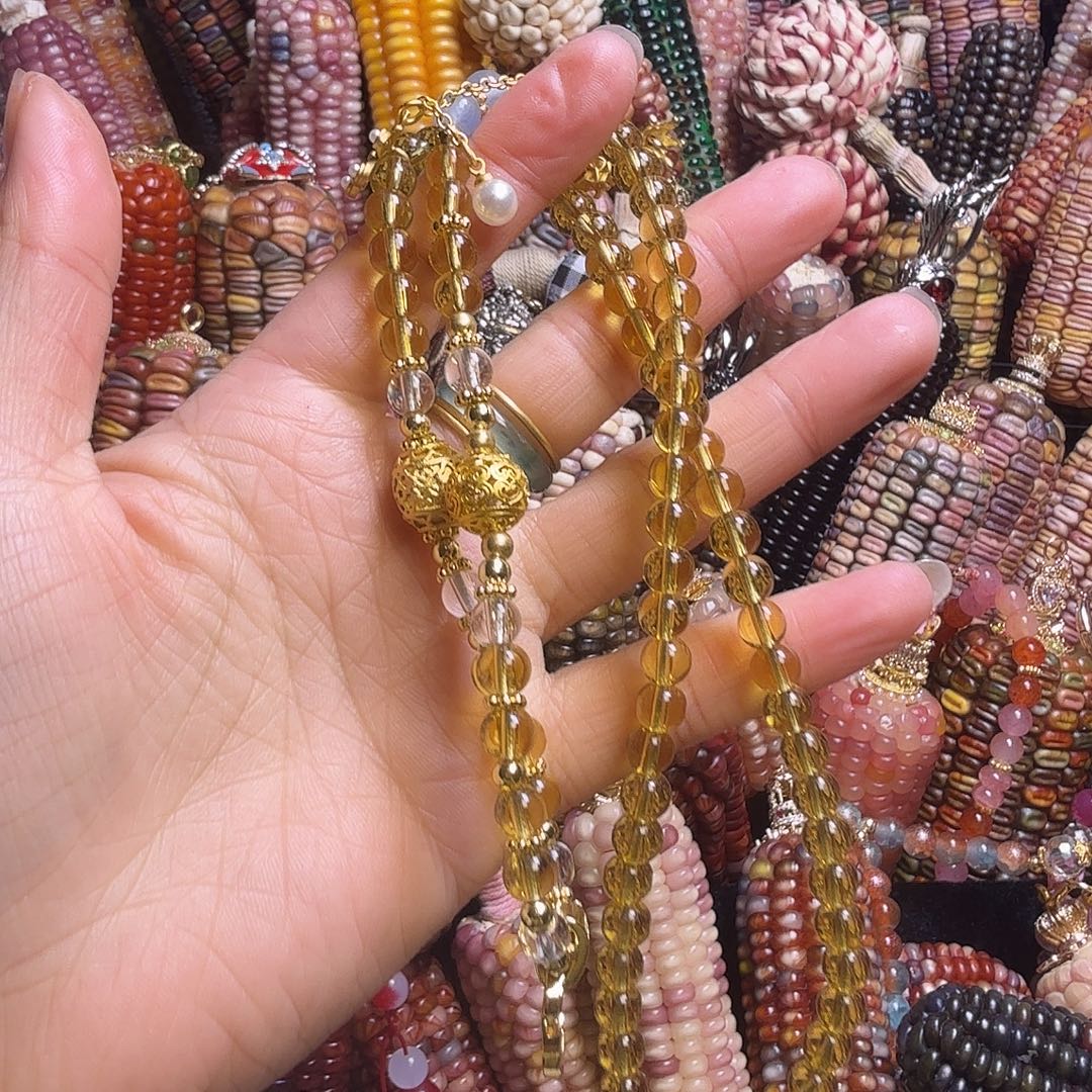 吕***改亚克力合金黄色水晶毛衣链
