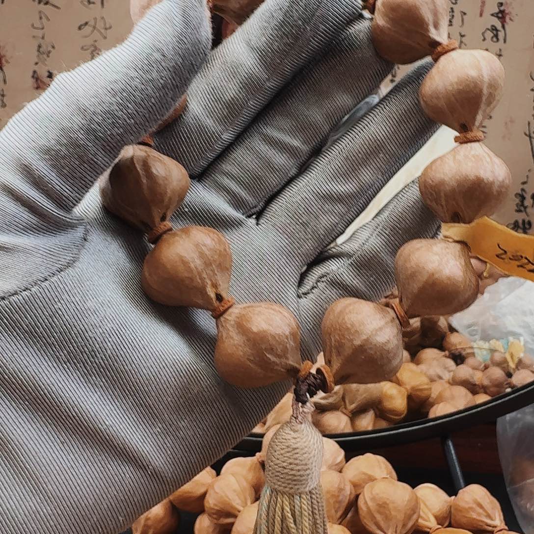 花***生手串橄榄核三面佛