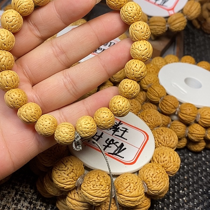 带***哥手串桃核野生金豆1.2