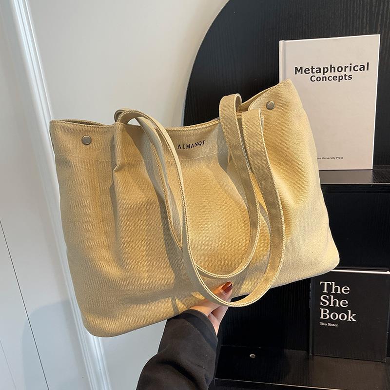 韩国休闲大容量帆布包女新款2024夏通勤手提包小众设计学生托特包