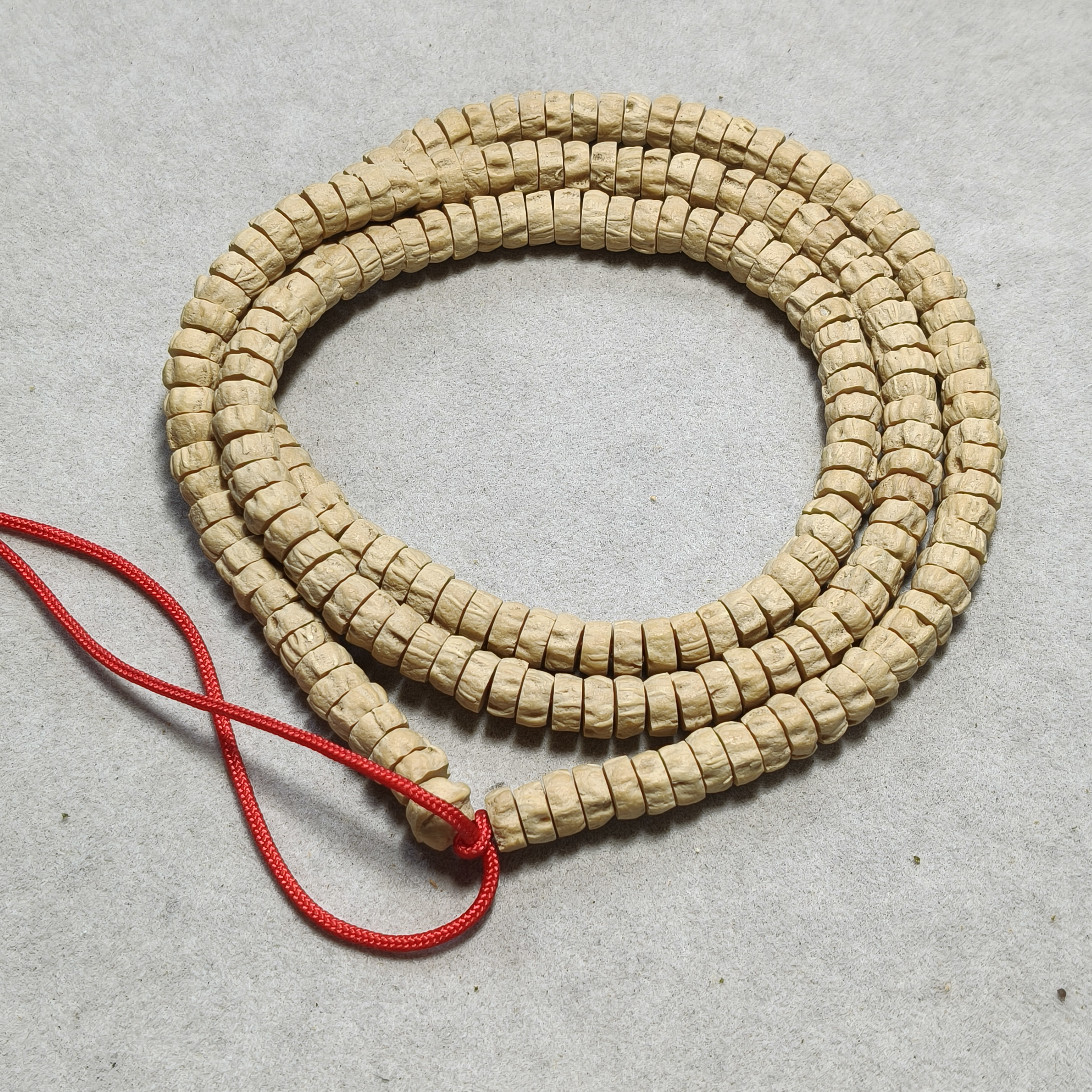 a77 热振藏切百香籽卡0.6-0.7片珠长串