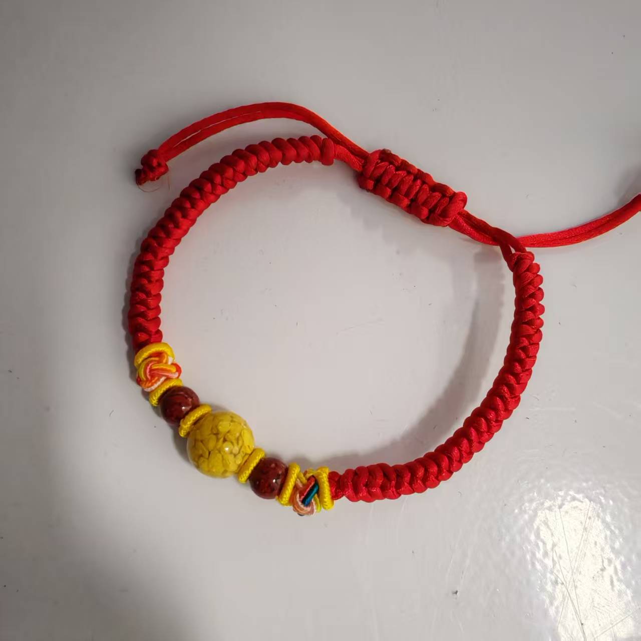 含辰砂工艺品NH024-纯手工编织带一颗雄黄珠子手链