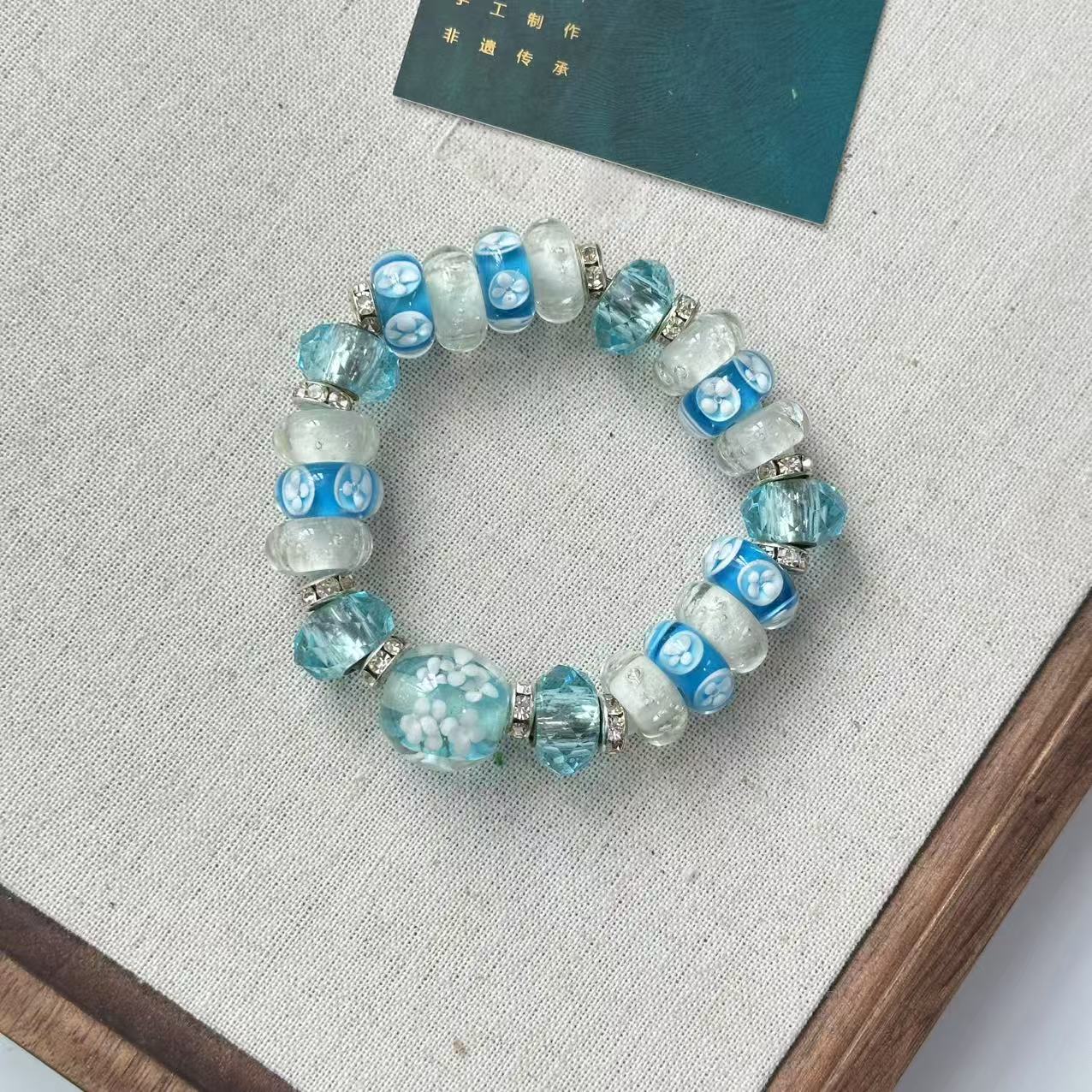 合金手链 玉楼东 合金手链 QC065  蓝色小花蓝色转转筒琉璃手串