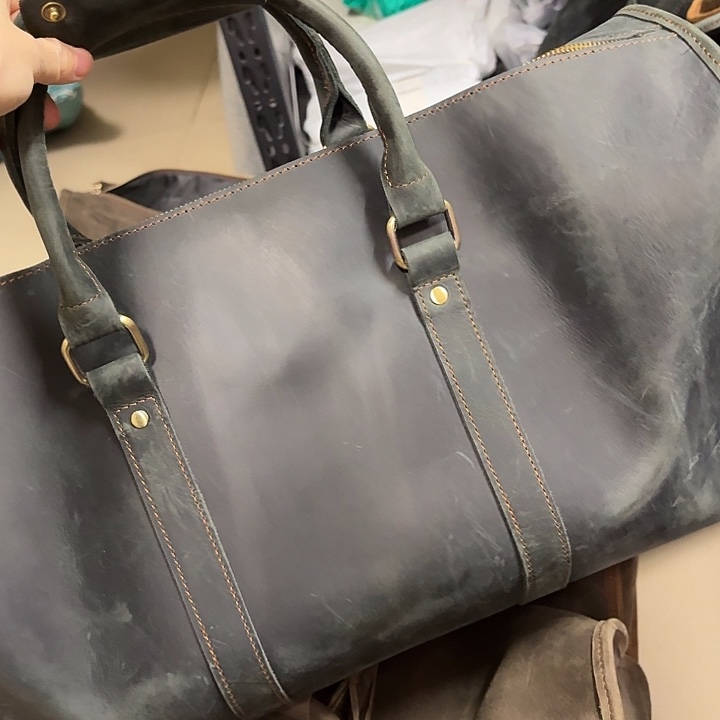 头层牛皮墨绿旅行包