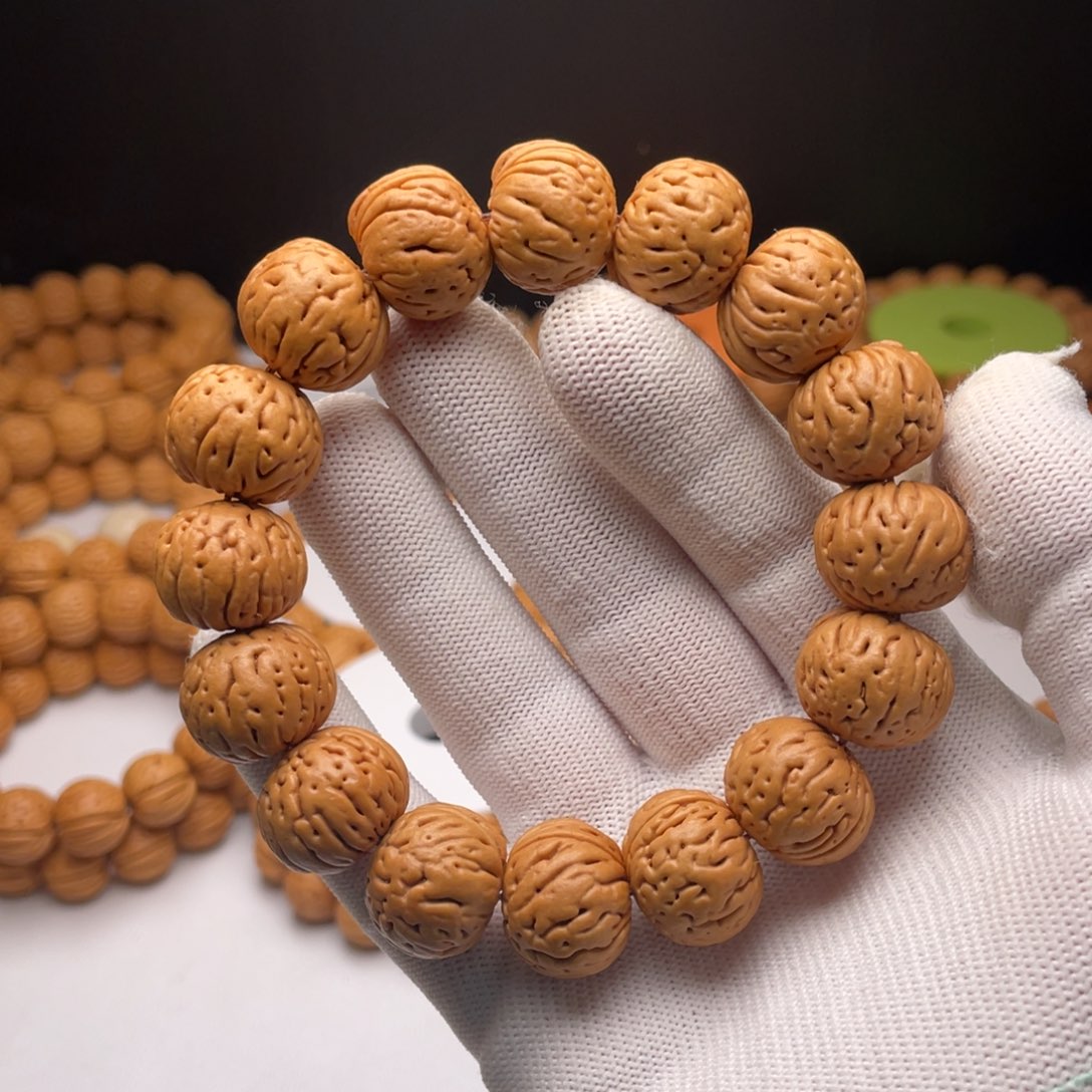 风***8桃核手串肉纹元宝