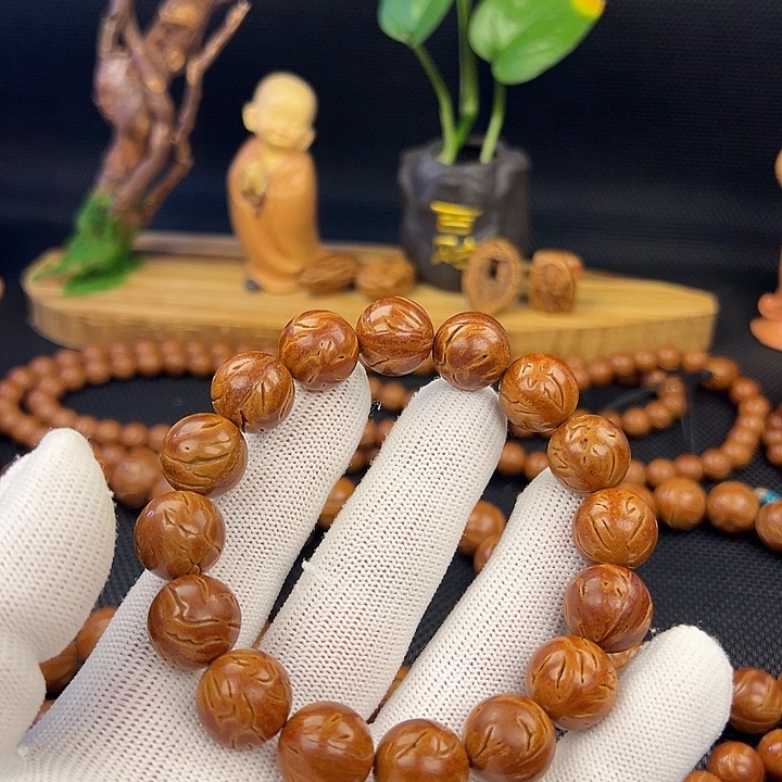 爻***野生龙纹桃核光珠