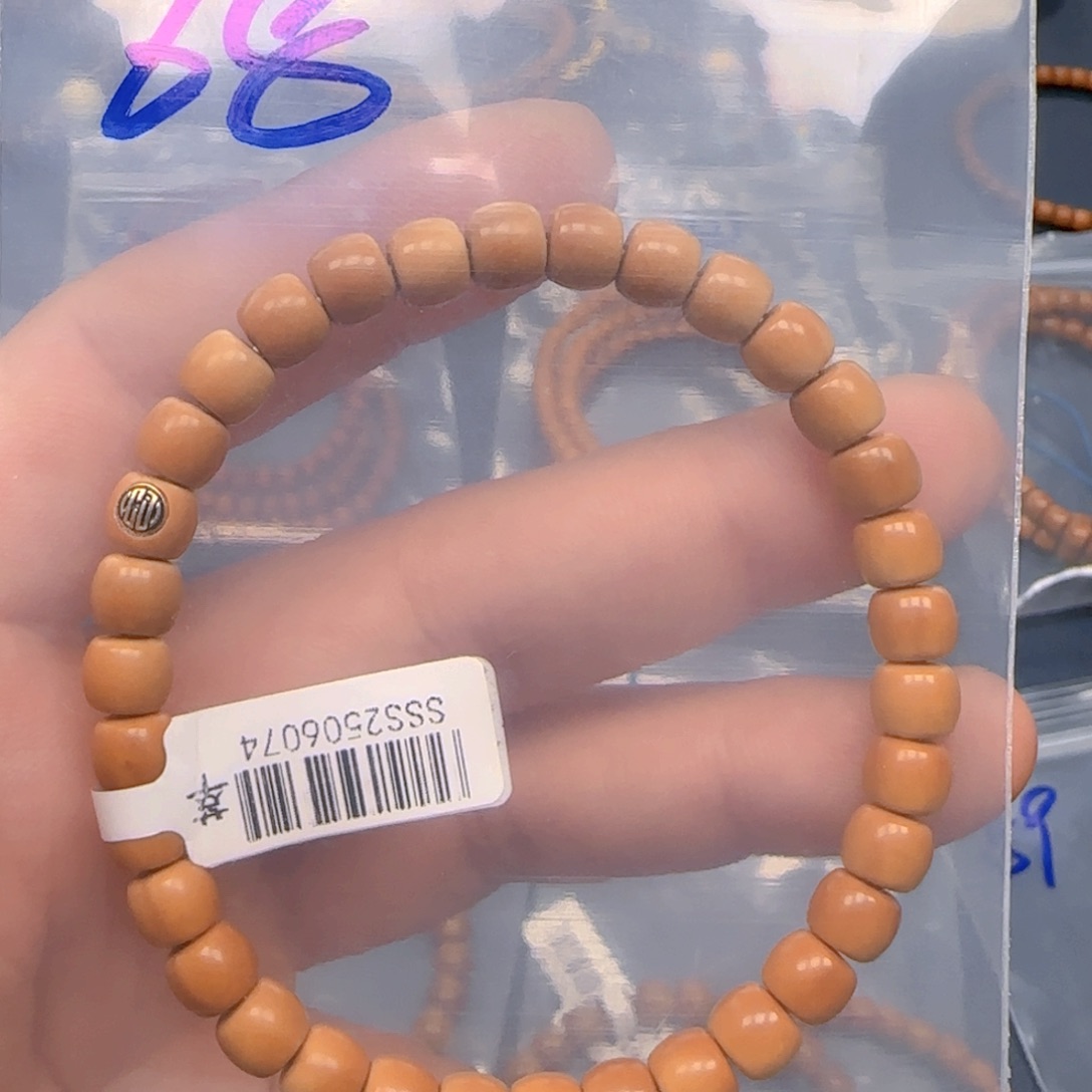 淡***0手串橄榄核老挝SS级核尖极限弧尺寸6.8