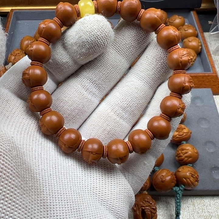 橄榄核手串暴***猫橄榄核雕工艺制作