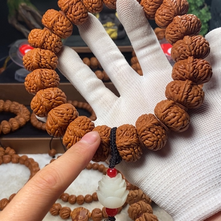 桃核吊坠简**乐秦岭龙纹