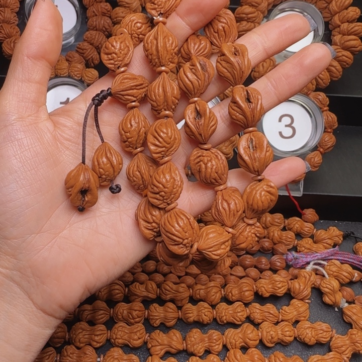 喝***酒桃核手串生命手持