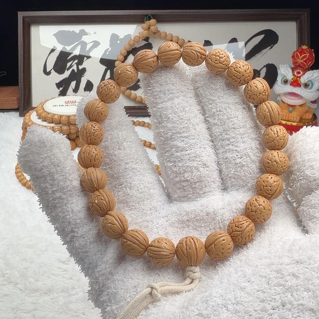 吜***渔手串桃核1.1加「超级圆」野生桃核手持