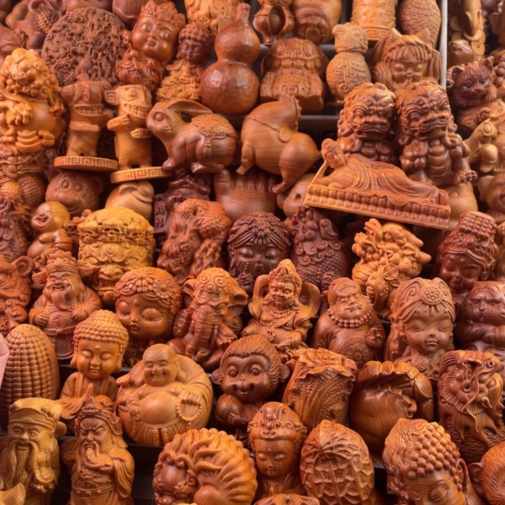 崖柏一物一拍手把件