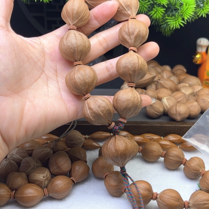 L***k手串/手链橄榄核2.5*2.6原皮四花铁核