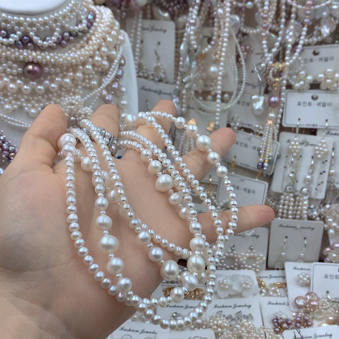 钱****淡水珍珠银S925镶嵌耳饰