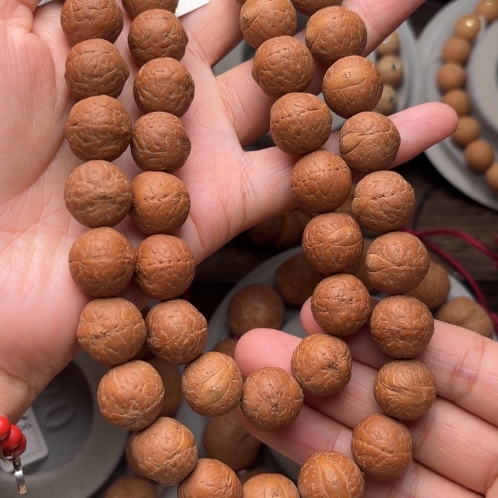 凤眼菩提吊坠14.5m m手持