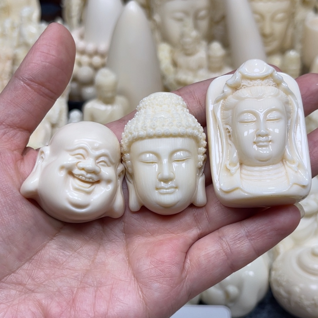 红***仰猛犸象牙把件佛头