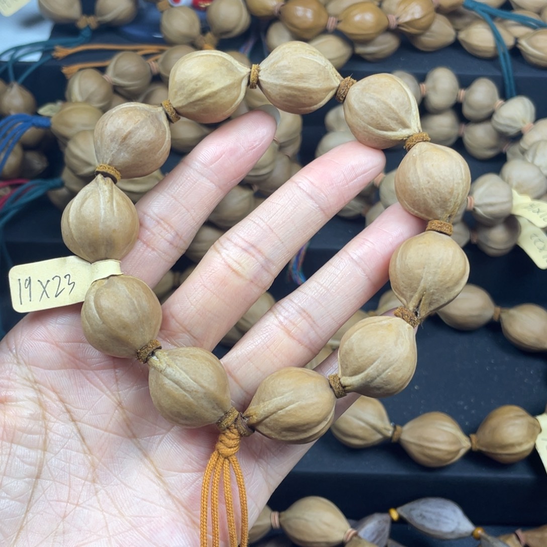 缘***停003橄榄核三花19*23