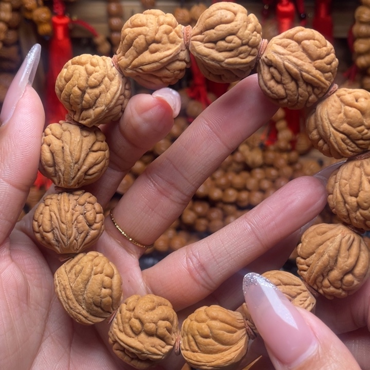 梦***人木质类龙纹桃枭手串