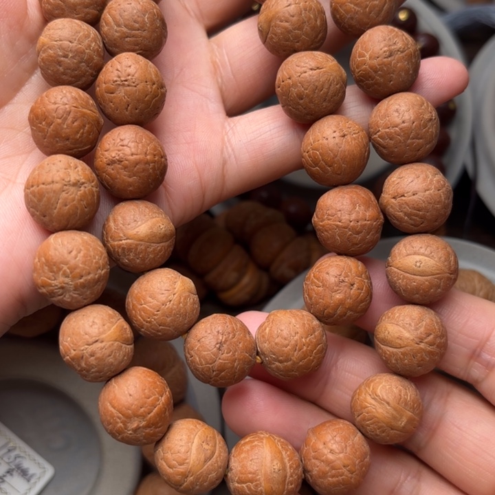 凤眼菩提吊坠14.5m m手持