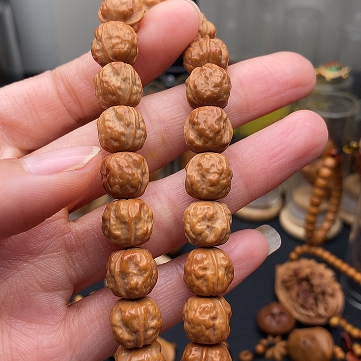 橄榄核吊坠欣*猪猴头手持
