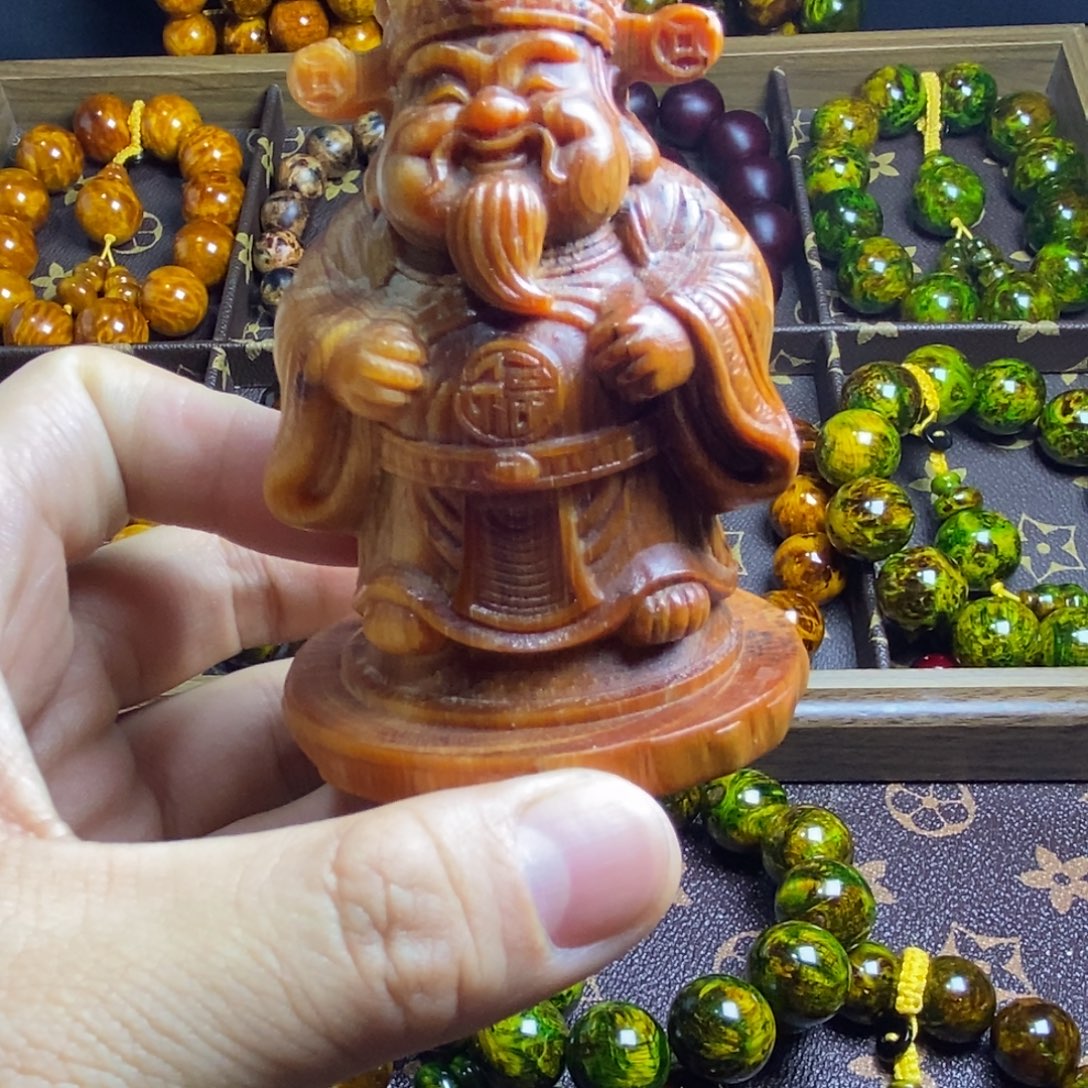 3***3木质琥珀木财神爷手把件
