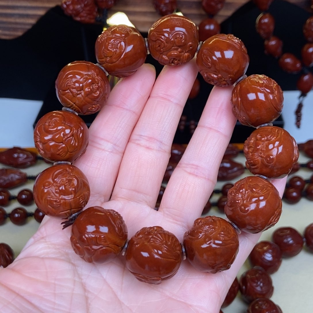 橄榄核吊坠過*。财神弥勒