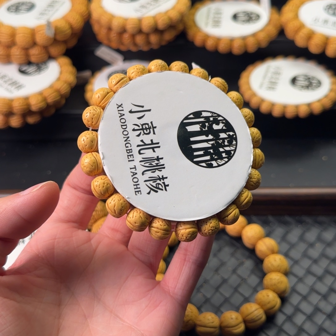 ****荣桃核手串精品盘锦金豆