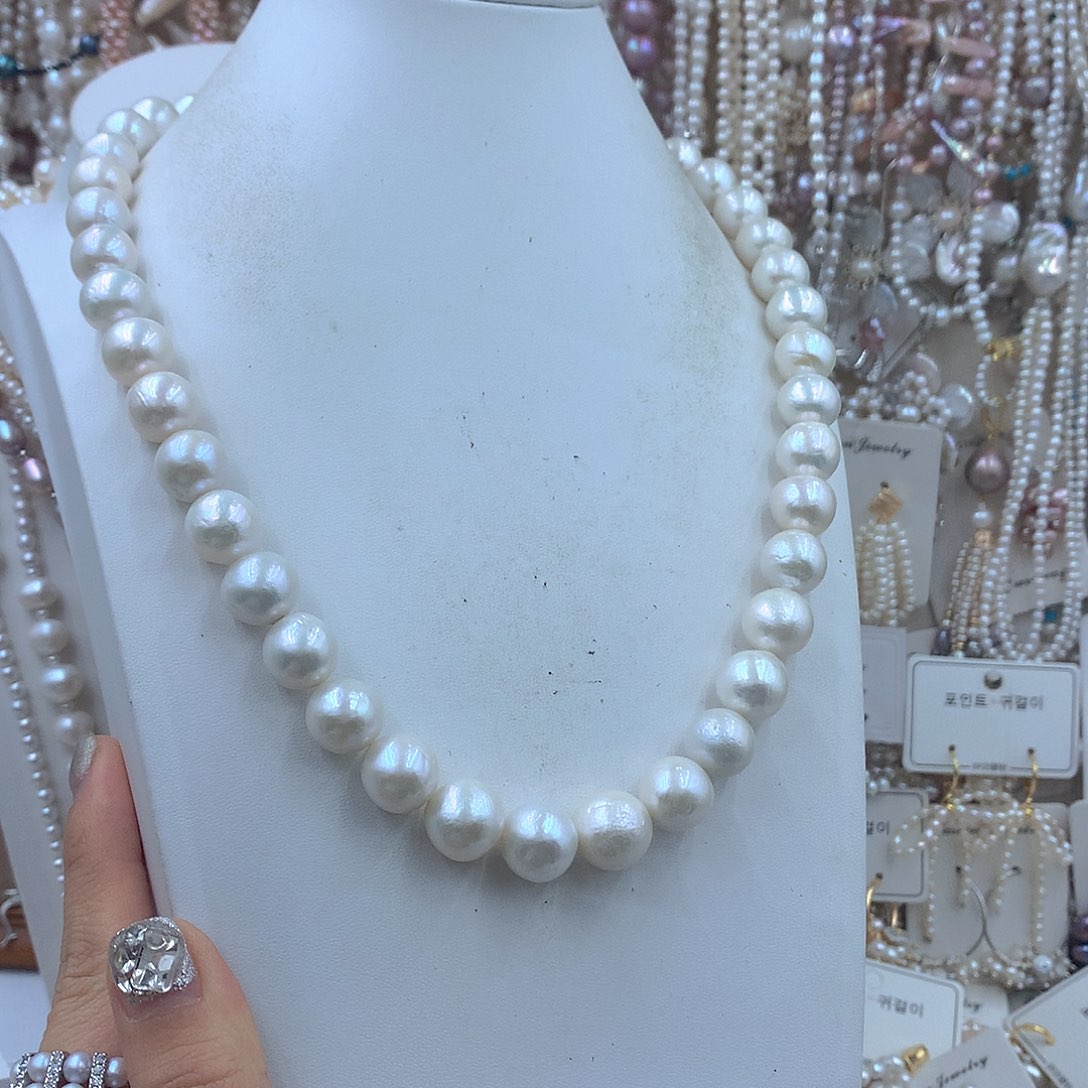 哆****淡水珍珠耳饰银S925镶嵌