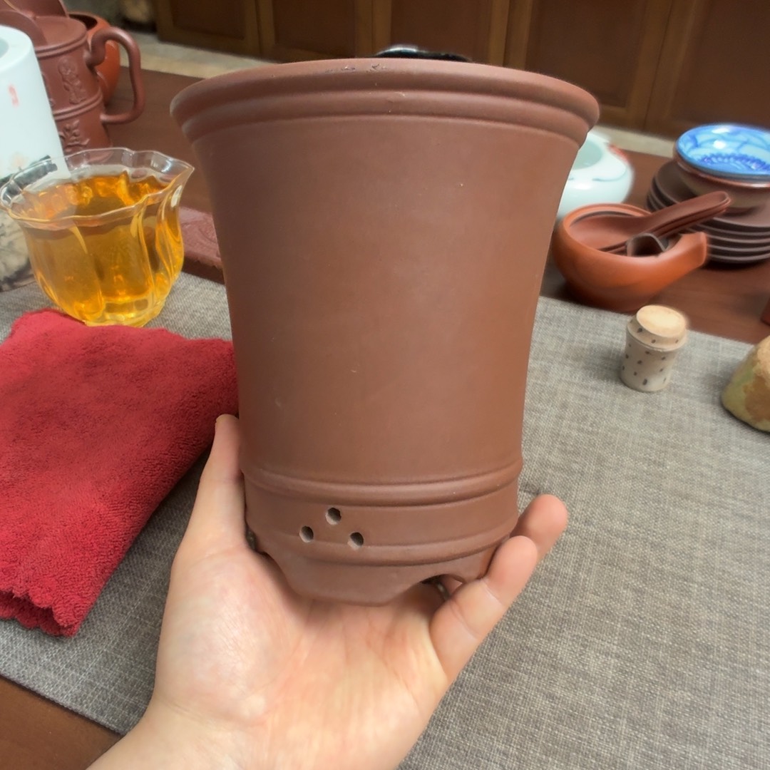 紫砂茶壶兰花盆。  