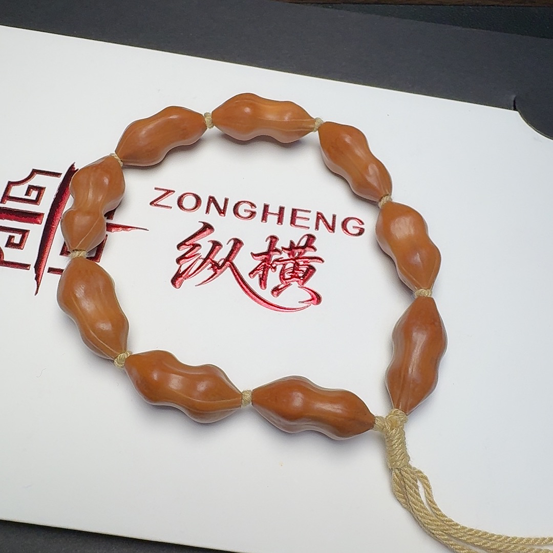橄榄核天然异型雕刻三面佛手串精磨抛光文玩手链