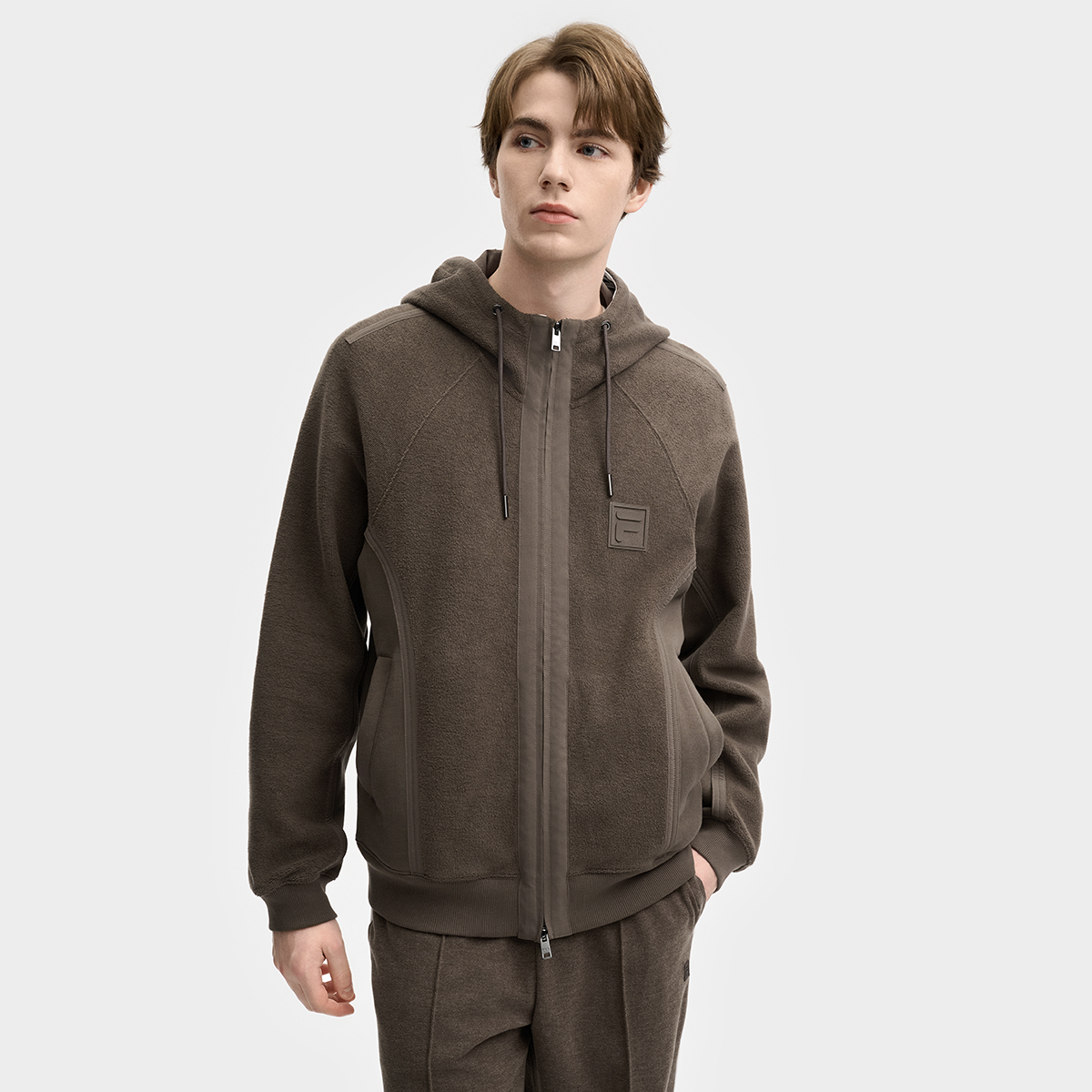 FILA斐乐情侣时尚休闲春季舒适宽松透气连帽针织外套F11M515501F