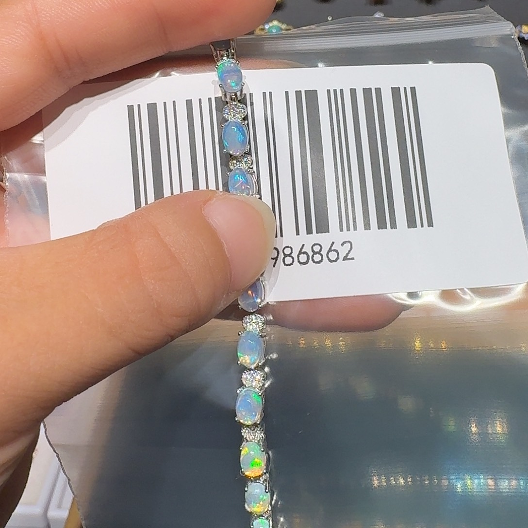 璃***、欧泊银S925镶嵌戒指戒指